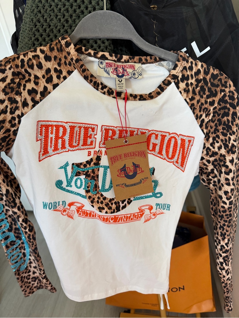 True Religion White Raglan Tee with Leopard Sleeves and Turquoise-Orange Logo